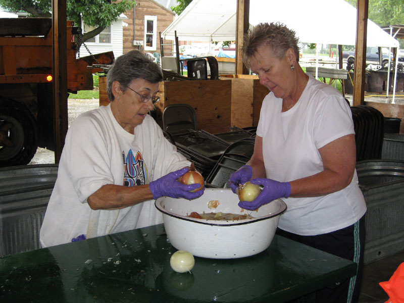 June Nobis and ? peel onions for the 2008 Burgoo.