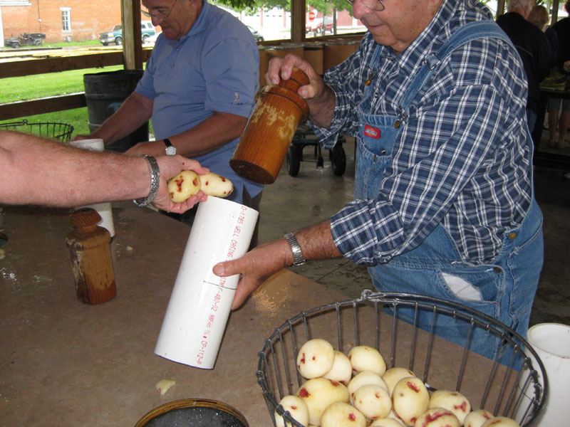 Dean Stock holds one of this year's new tools - a potato chopper designed by Donald Kinsey.