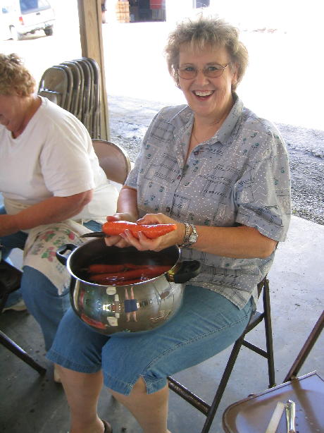 Diane Miller peels carrots.