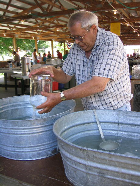 Jim Beard washes a container for kettle service.