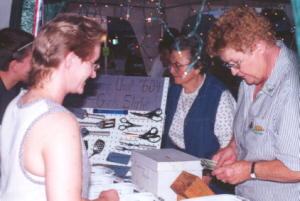 Lois Stock sells cutlery for the Legion Auxiliary.