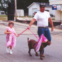 Fancy boa, hat for your dog -- you're ready for the Kids' Parade!