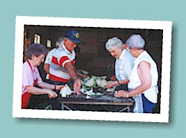 Chopping cabbage: Fran Nelson, Gib Harbin, Roberta Clark, and Doris Lovekamp.