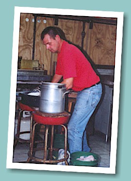 Troy Alexander fries up a batch of catfish for hungry customers on Thursday evening.