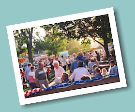 Friends and neighbors visit in the Village park.