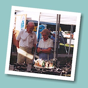 Ross and June Houston admire a ceramic Christmas village displayed by one of the crafts vendors.