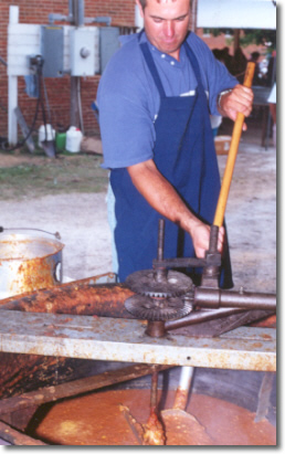 Gerhard Taylor dips into the burgoo kettle