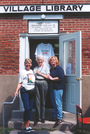 Marsha McEvers (left) and Judy Logan (right) enjoy a reunion with their high school English teacher, Roberta Clark.