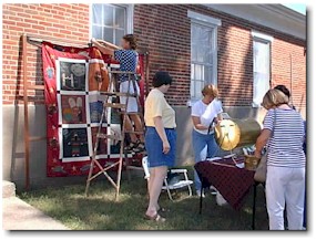 Raffle tickets for the Triopia Women's Club's Bible Stories Quilt were a hot item. Emma Davis was the winner.