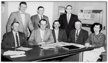 School board, Arenzville High School, 1958-59. From left: Arthur Carls, Ralph Ginder, Warren Stock, Edwin Dietrick, Edwin Lovekamp, Y.G. West, Arlo Schumacher, Margaret Baird.