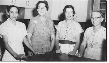 1958 - Cooks for Arenzville High School: from left: Edna Lovekamp, Amelia Wessler, Pauline Grant, and Inez Dahman.