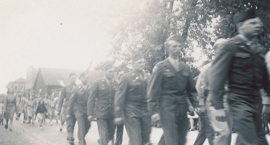 Servicemen parade through the town to the cheers of their family and friends, who are glad to have them home.