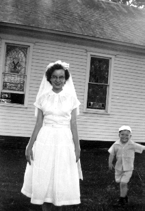 Connie Hobrock and John (Tinker) Anderson, Confirmation day.