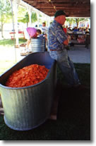 Dave leans on tank of carrots