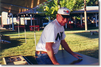 Joe Stinson moves a table